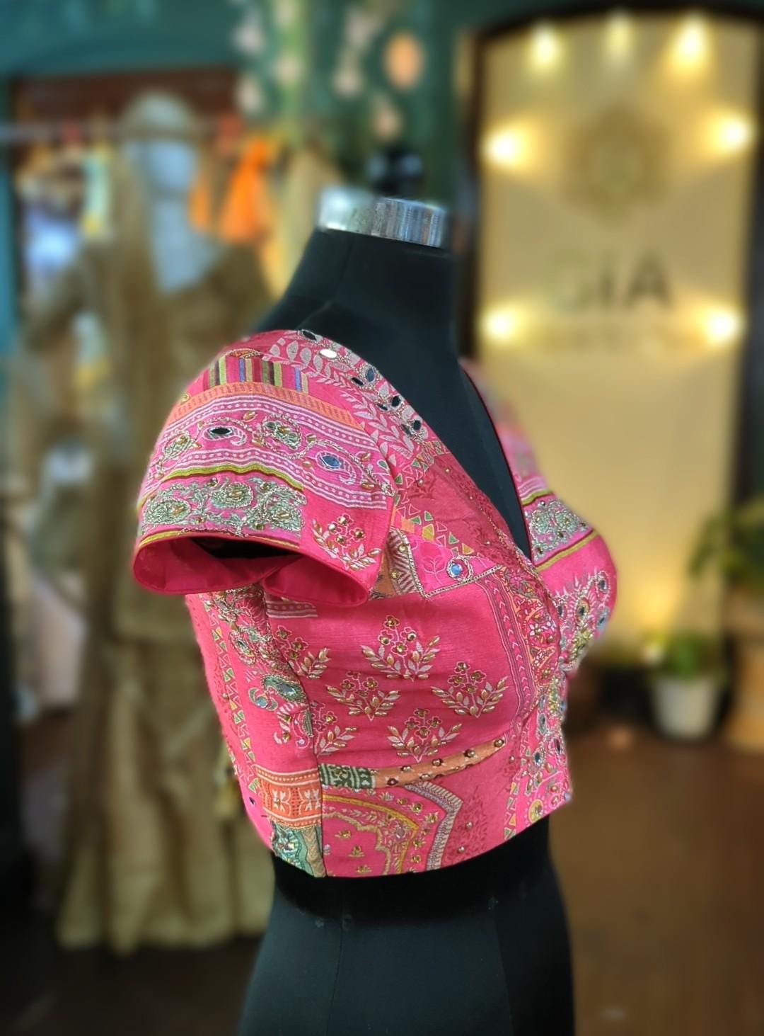 Beautiful multicolor pink based mirror embellished blouse with v neck