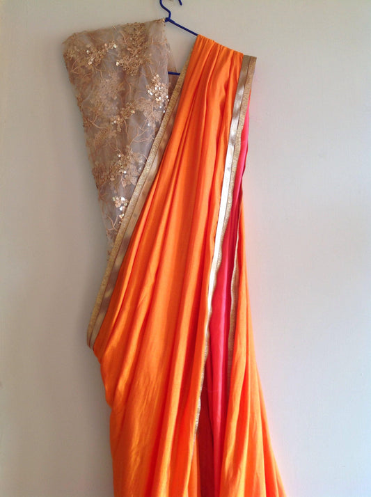 Orange semi silk saree with embroidered net sequin blouse