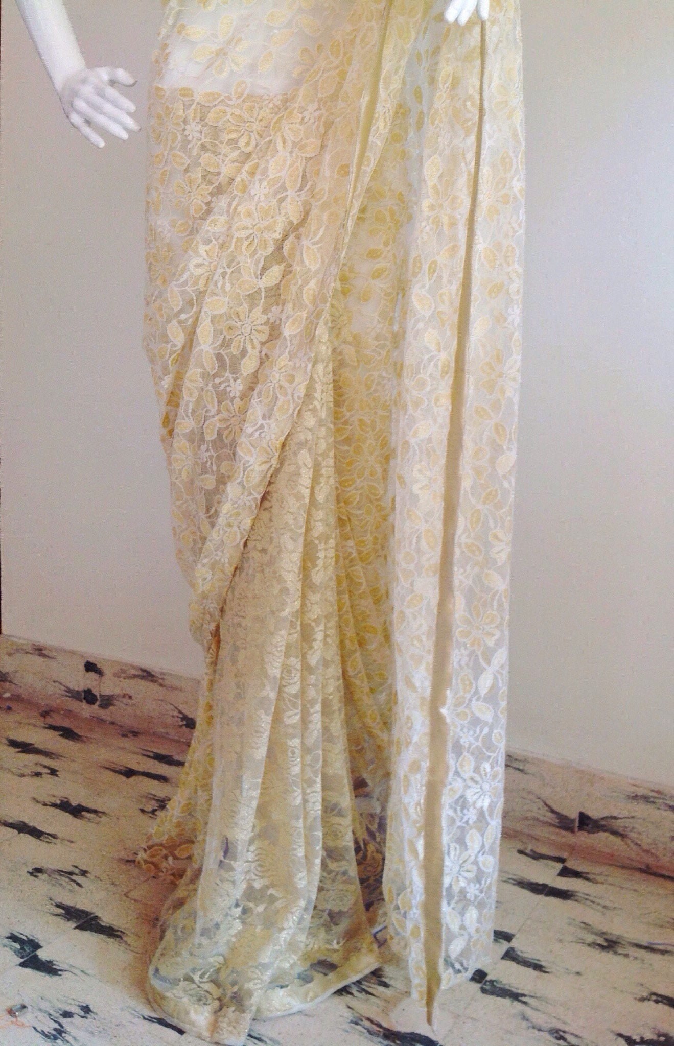 Gold and white lace saree with a gold blouse