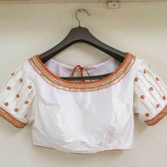 Custom fit white pure silk blouse with bead thread and sequin work on neck and sleeves.