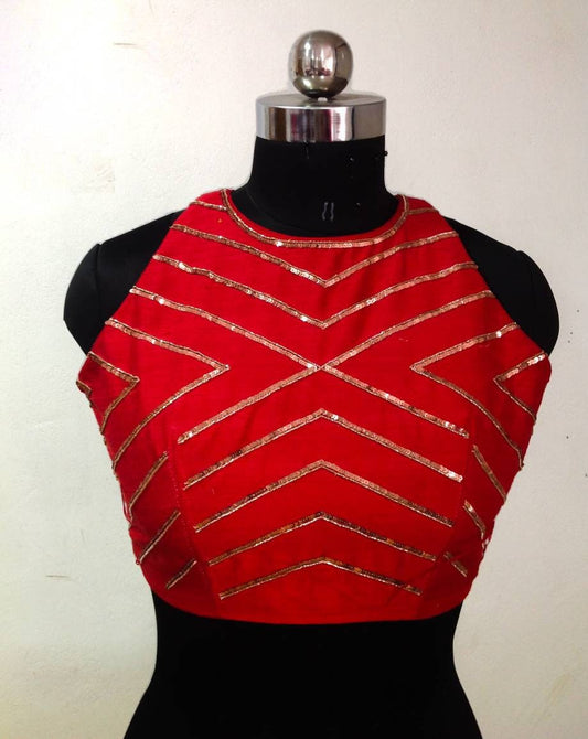 Stunning red halter neck blouse with geometric sequin embroidery.