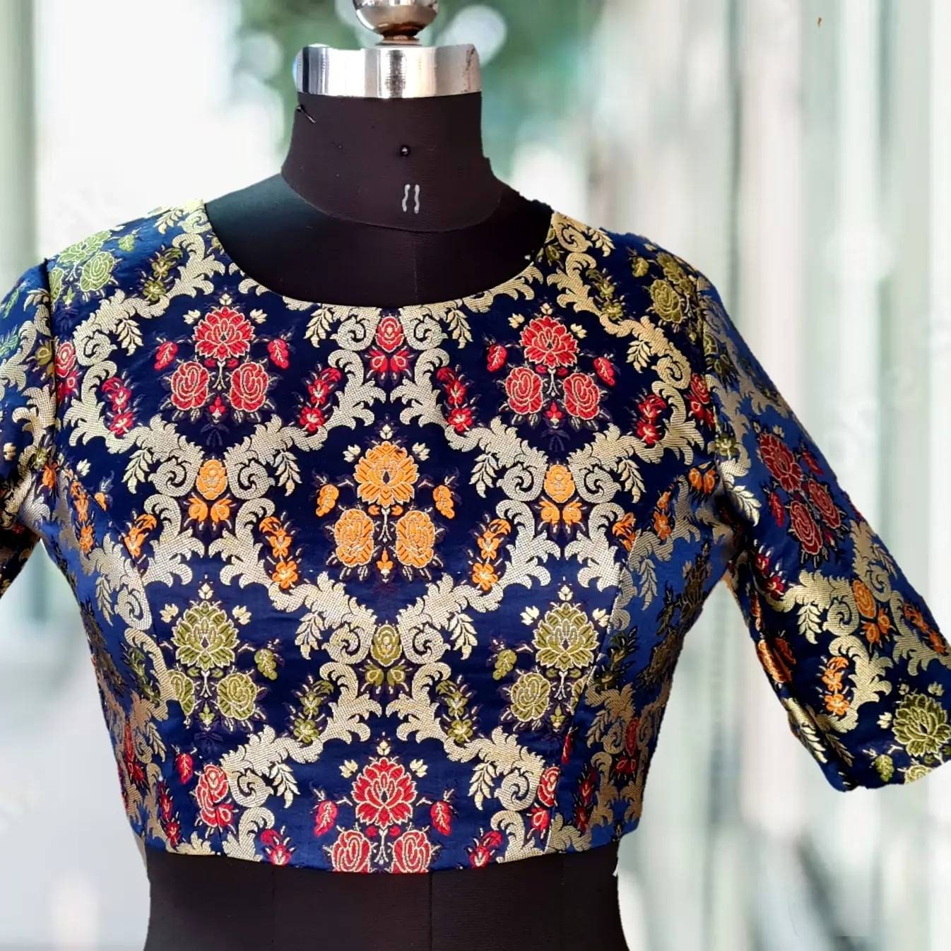 High round neck multicolor brocade blouse in navy blue base color with zipper back
