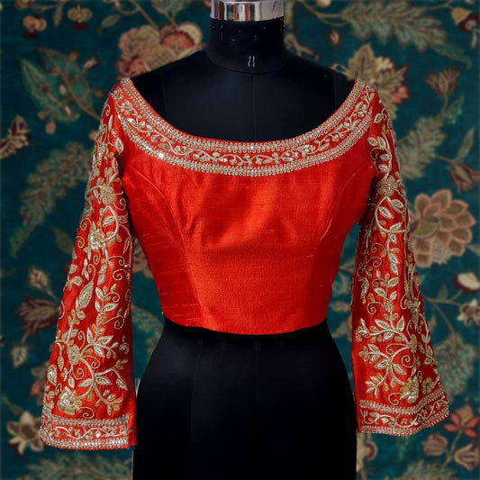 Orange red offshoulder rawsilk blouse with heavy aari embroidery and wide full length bell sleeves