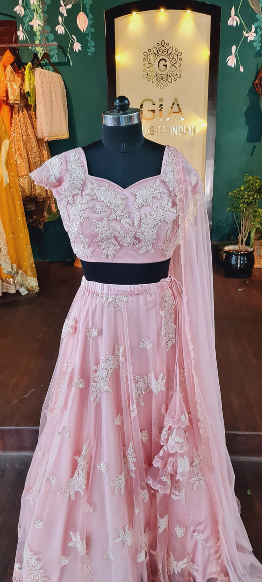 Blush pink net lehenga with thread and sequin work