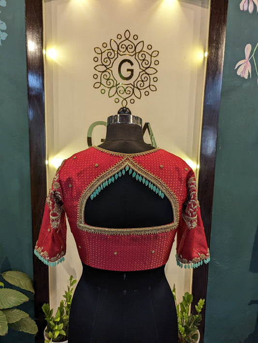 Red brocade bridal blouse with aari work