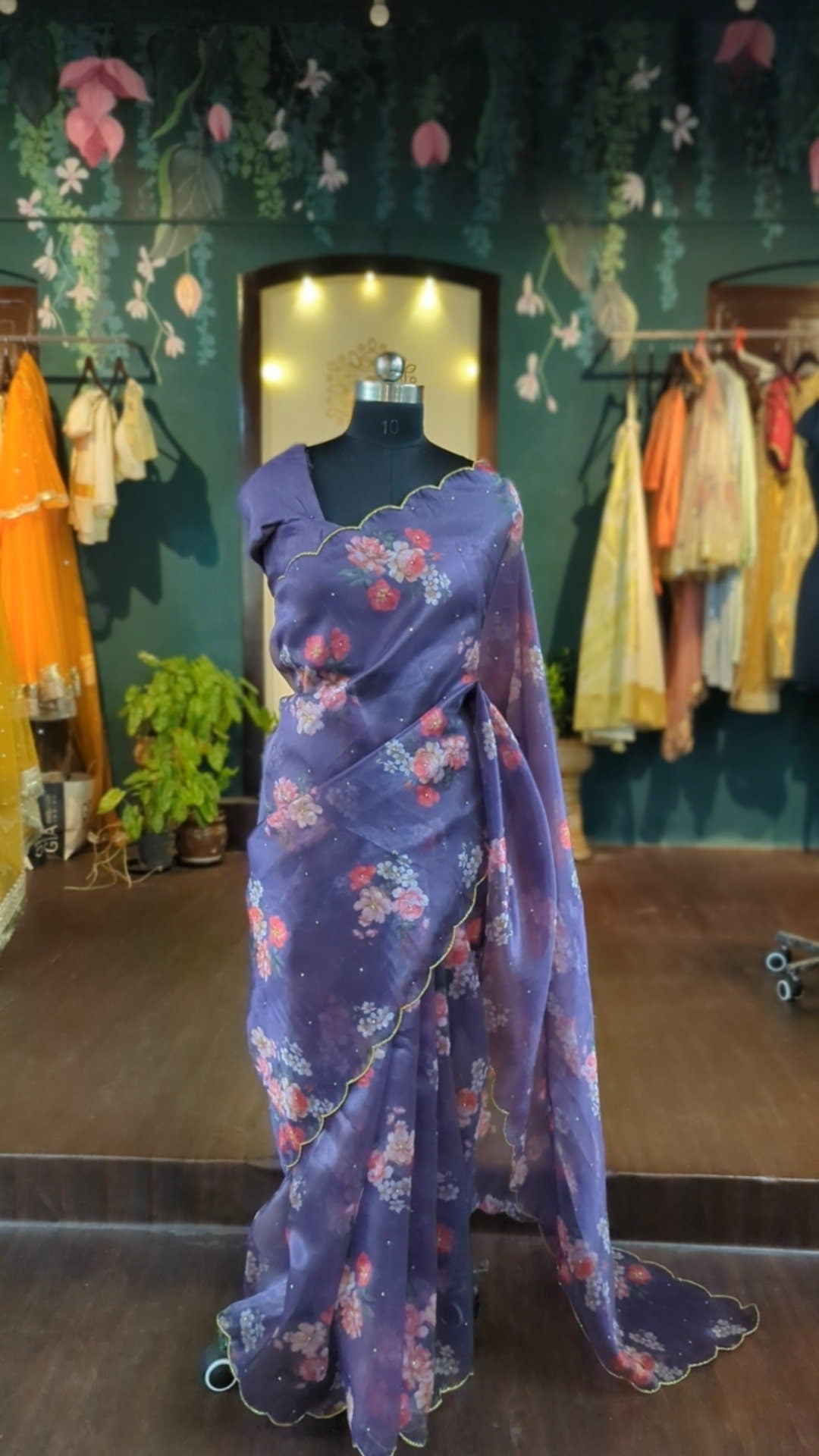 Beautiful purple organza floral saree with scalloped border and ready made blouse