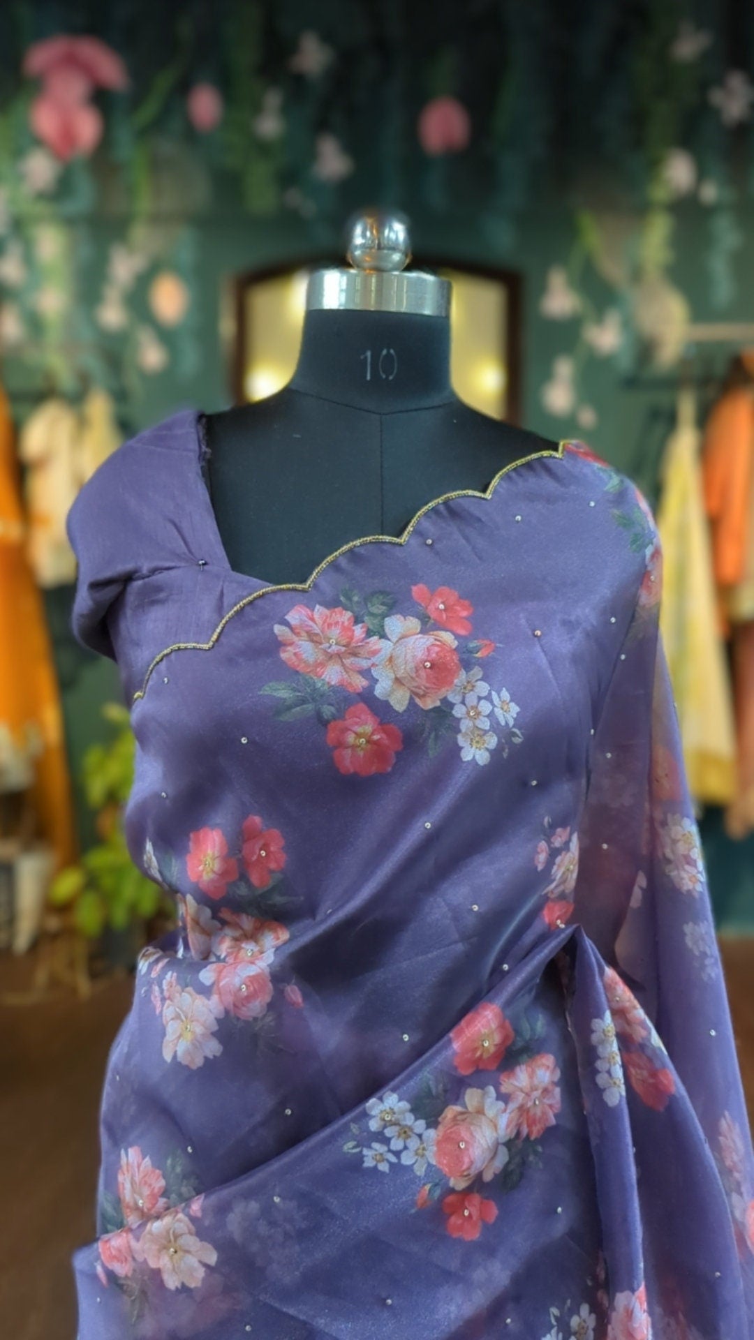 Beautiful purple organza floral saree with scalloped border and ready made blouse