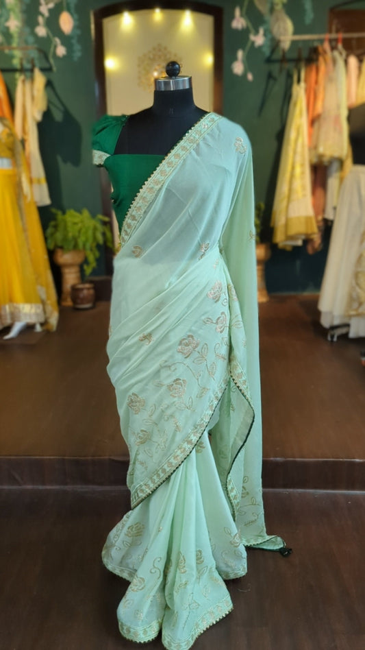 Green georgette saree with  deep green rawsilk blouse