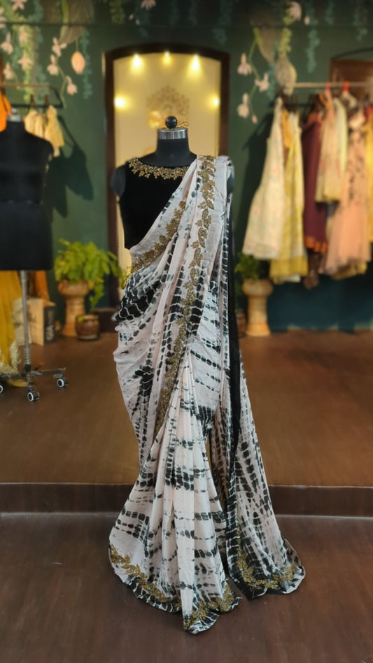 Shibori marble dyed blush and black satin Georgette saree with hand embroidery and embroidered velvet blouse
