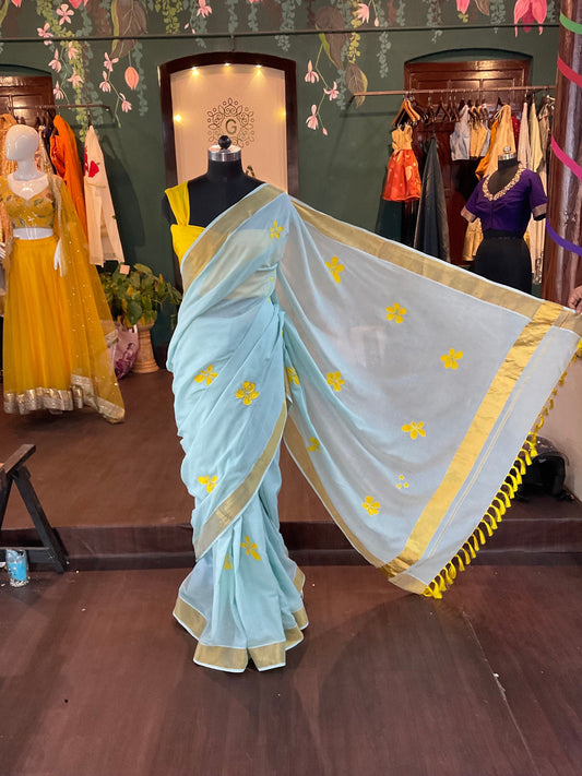 Sky Blue Kerala Saree with Yellow Floral Appliqué