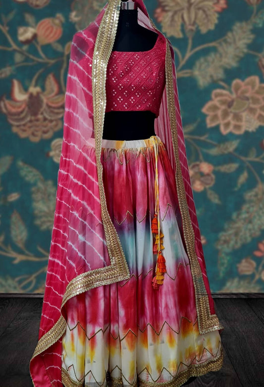 Beautiful multicolor shibori lehenga with mirror work blouse and lehariya dupatta