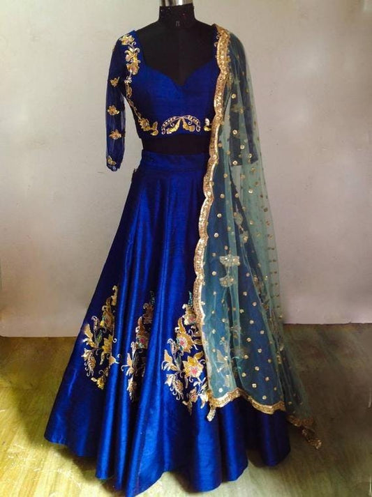 Stunning teal blue velvet lehenga with multicolor hand embroidery