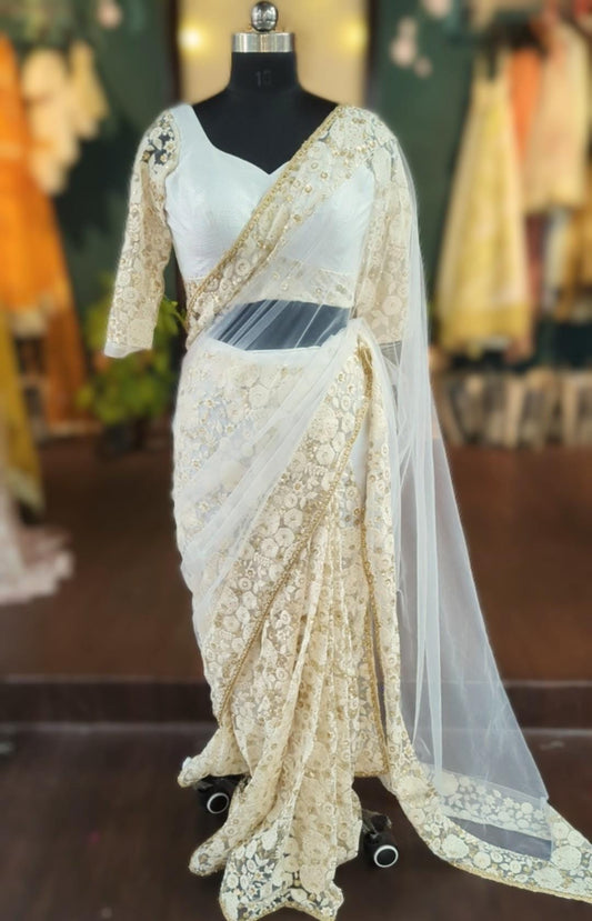Ivory soft net saree with linen and thread work blouse made to your measurements