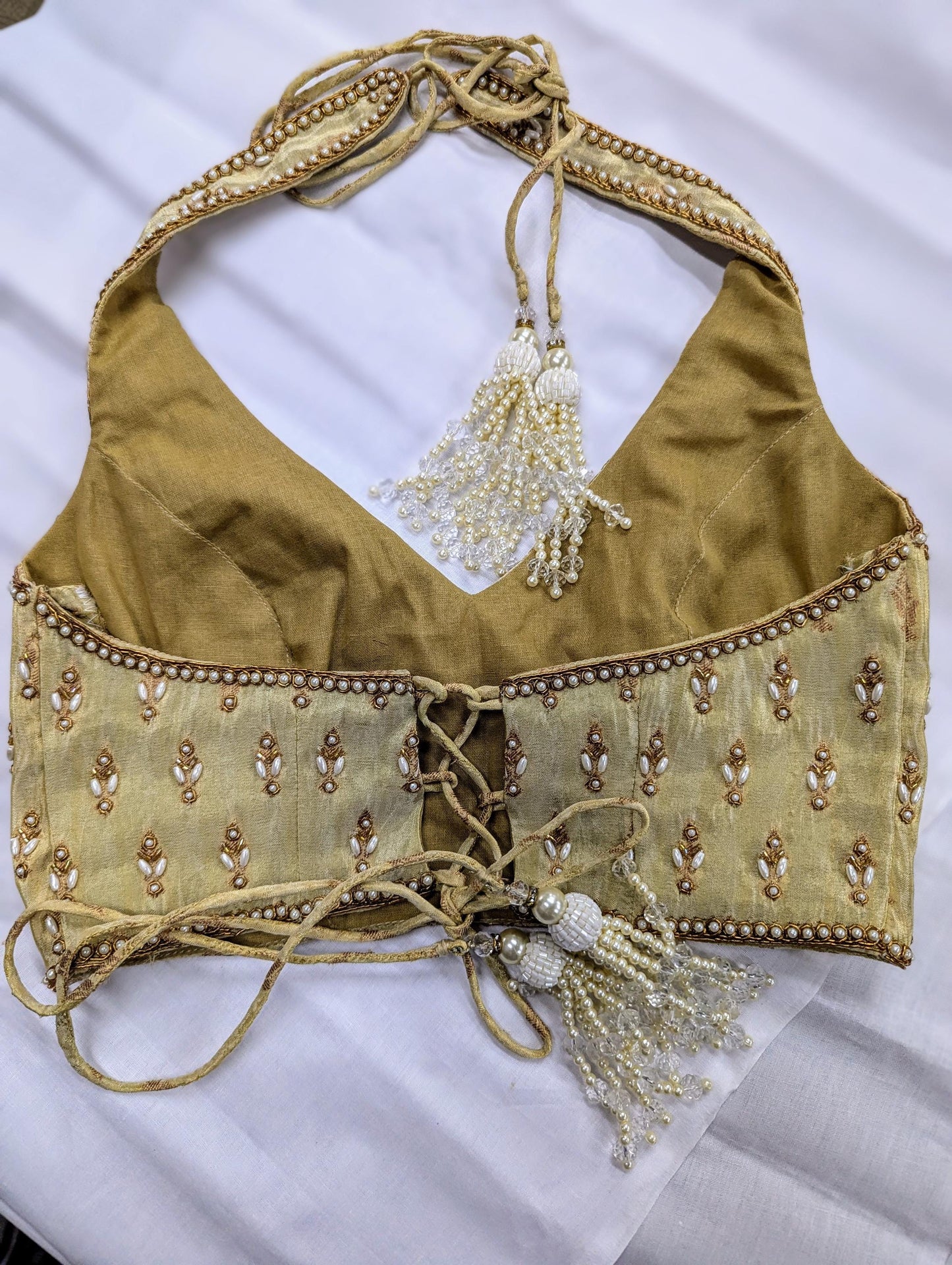 Olive green halter neck choli blouse with pearl handwork