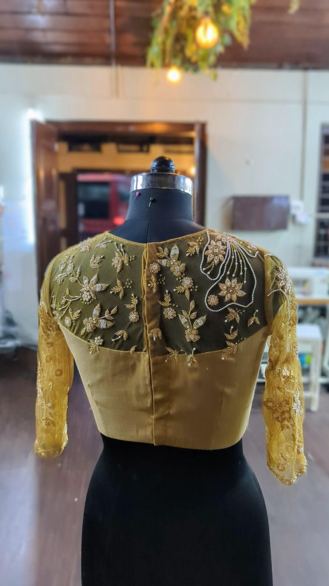 Gold tissue blouse with zardozi work