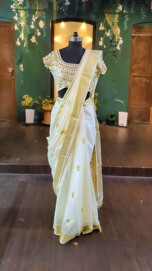 Kerala handloom kasavu saree with coin work jwellery blouse